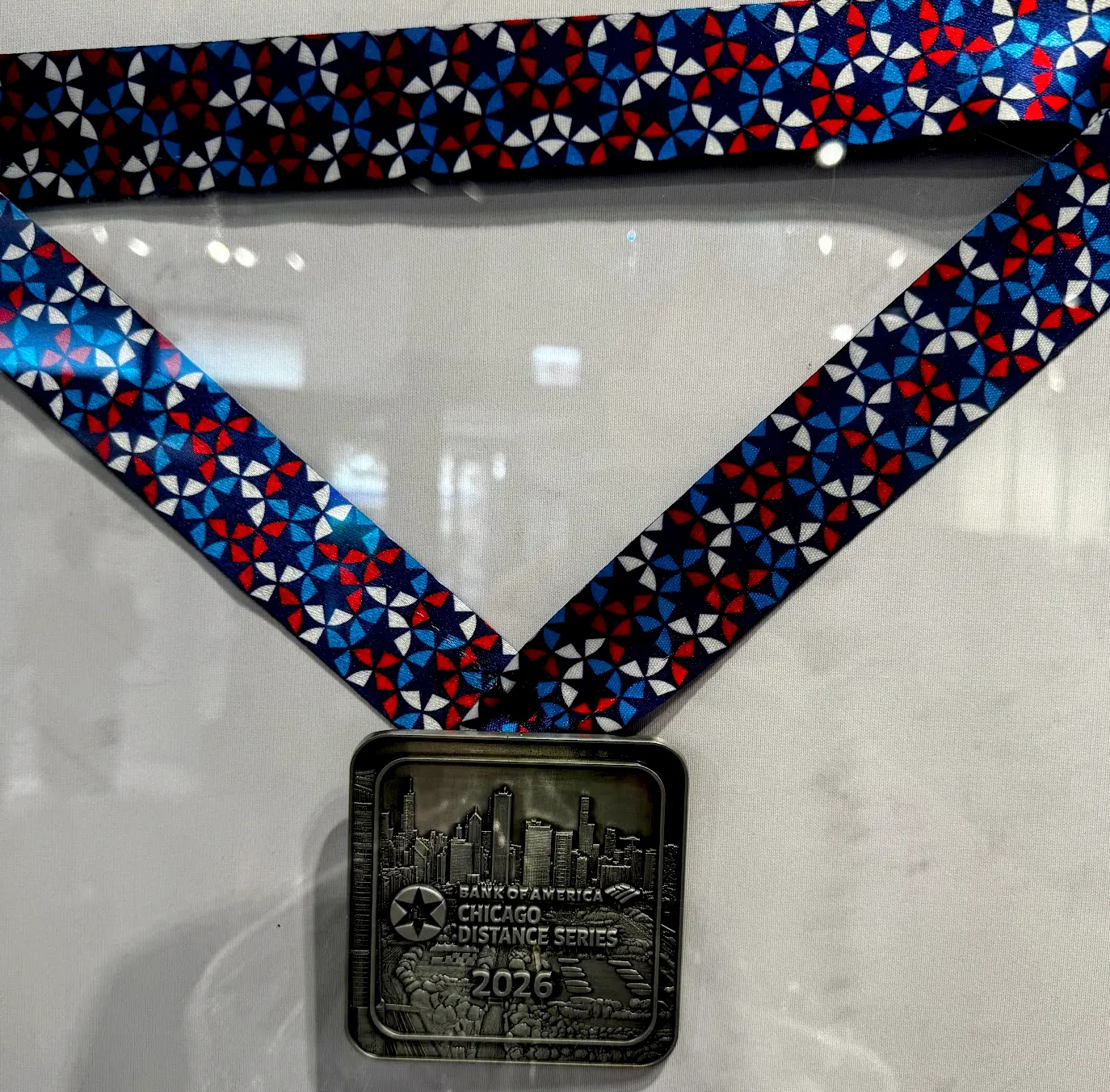 2026 Bank of America Chicago Distance Series finisher medal with Chicago skyline engraving and colorful ribbon