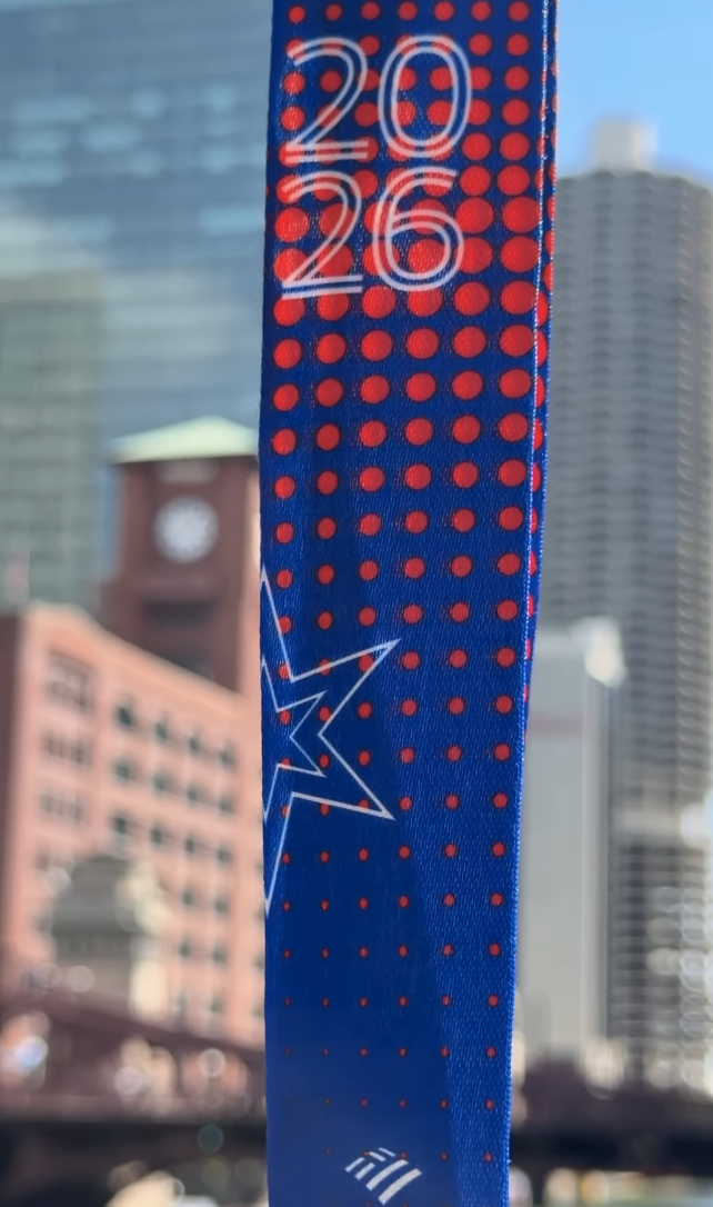 Ribbon for the 2026 Chicago Marathon medal with blue background, red polka dots, and 2026 in white