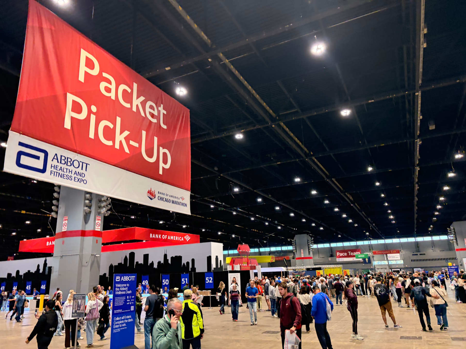 The Packet Pick-Up banner hanging above the registration desks at the 2026 Abbott Health and Fitness Expo in McCormick Place