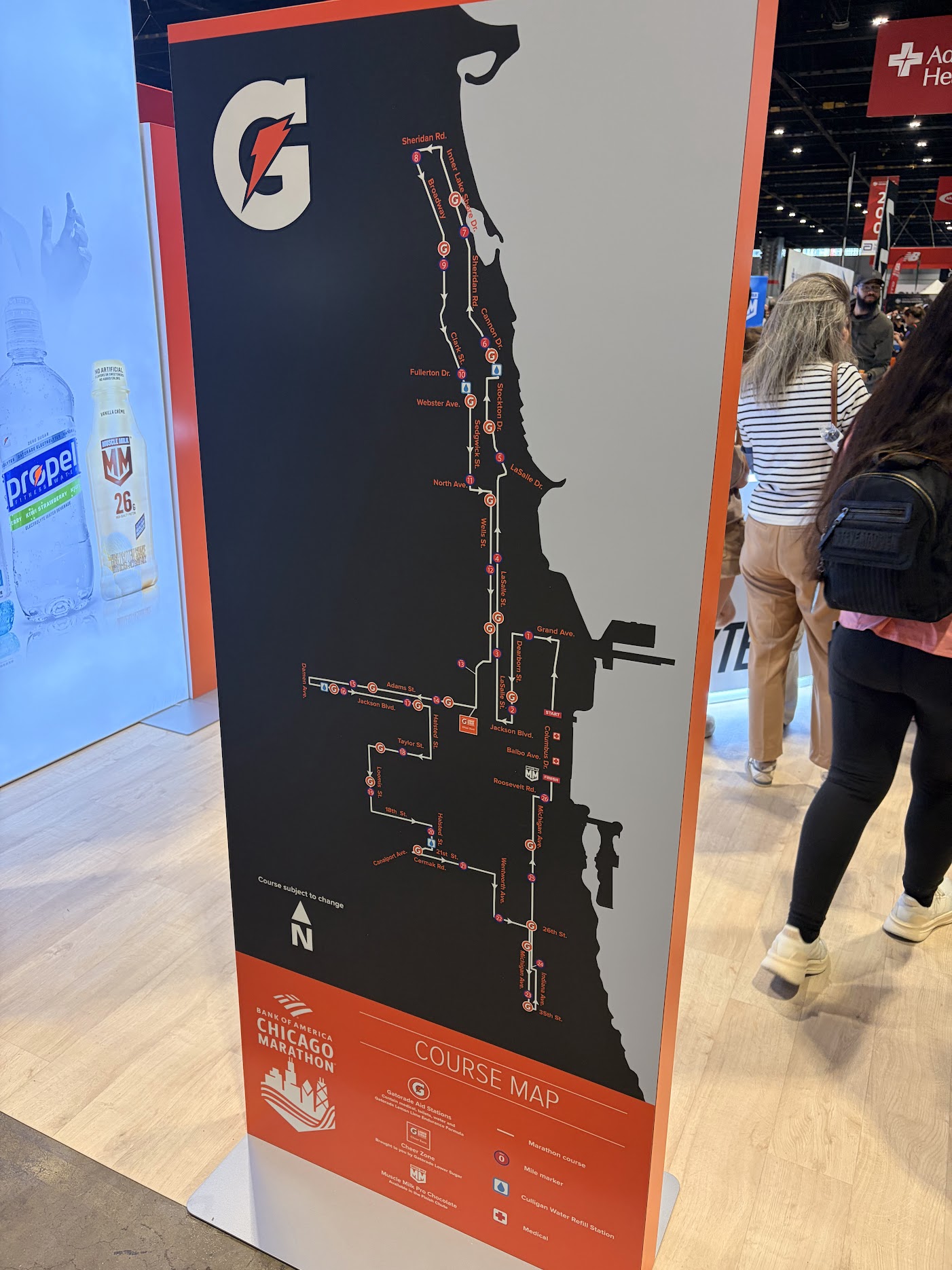 Full size 2026 Bank of America Chicago Marathon course map printed on a standing board at the expo, showing the route, mile markers, Gatorade aid stations, and water refill stations