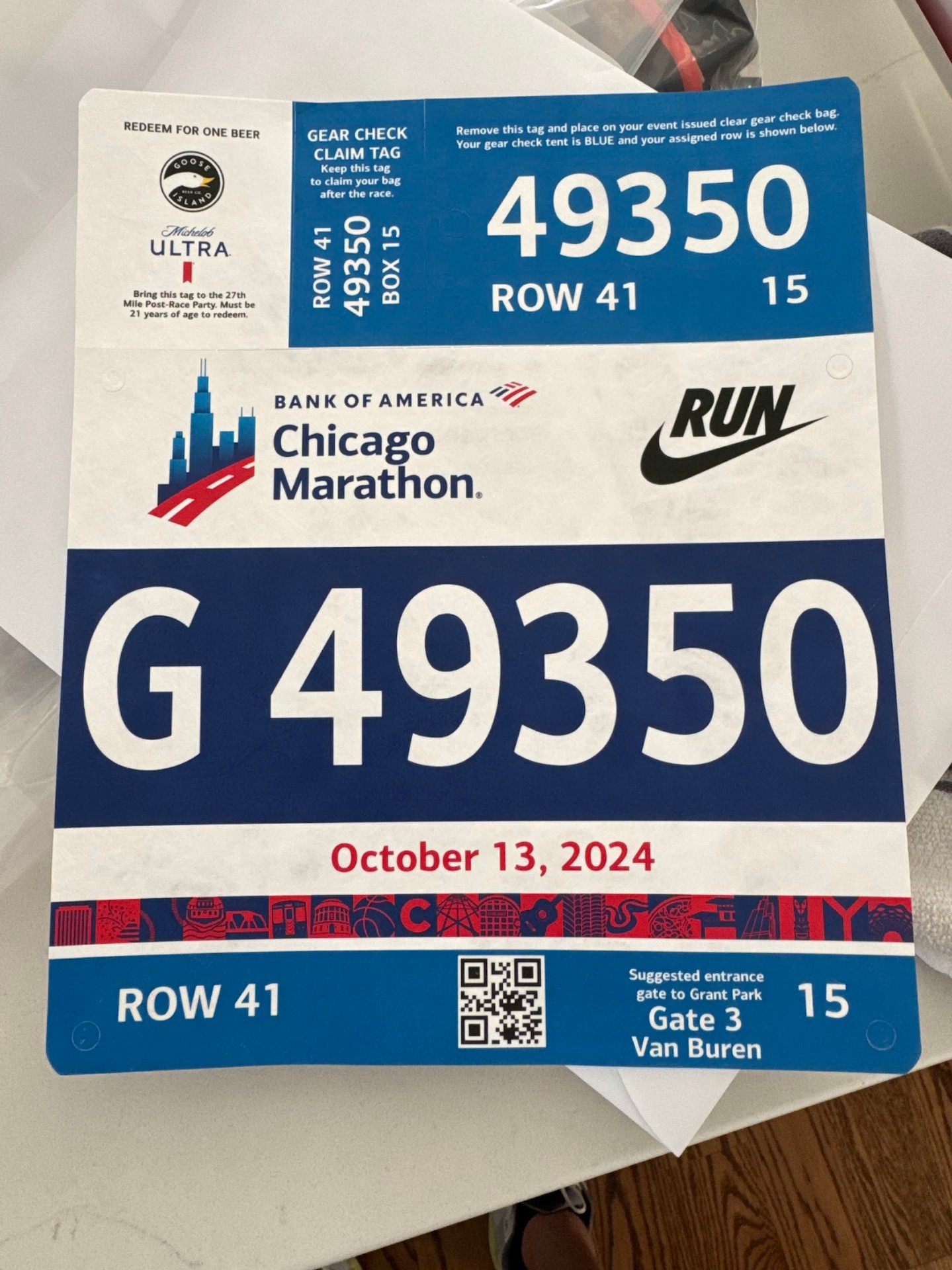 2024 Bank of America Chicago Marathon bib showing corral G, row 41, gear check info, and Gate 3 entrance